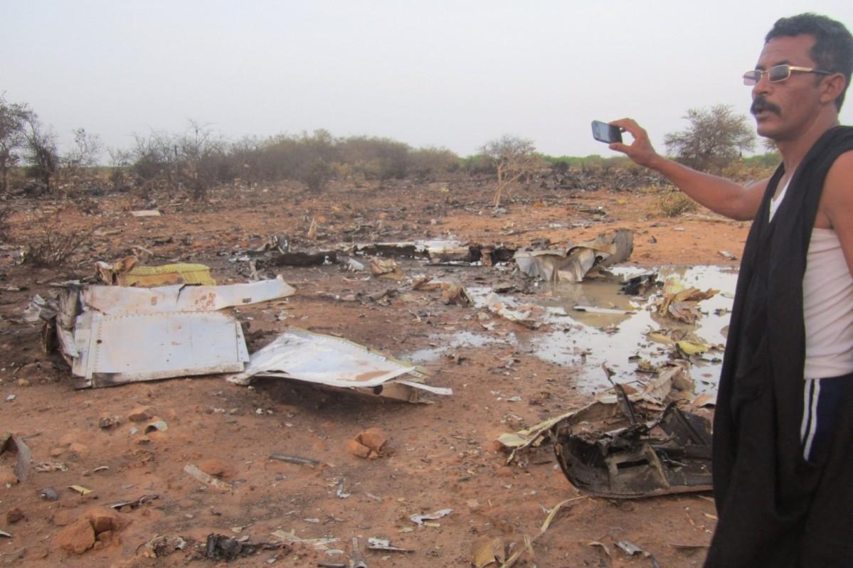A Man Clicks Photos of Debris of Air Algerie Air Algerie Crash