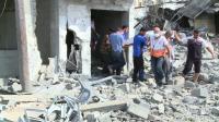 gaza-residents-walk-through-rubble-during-truce