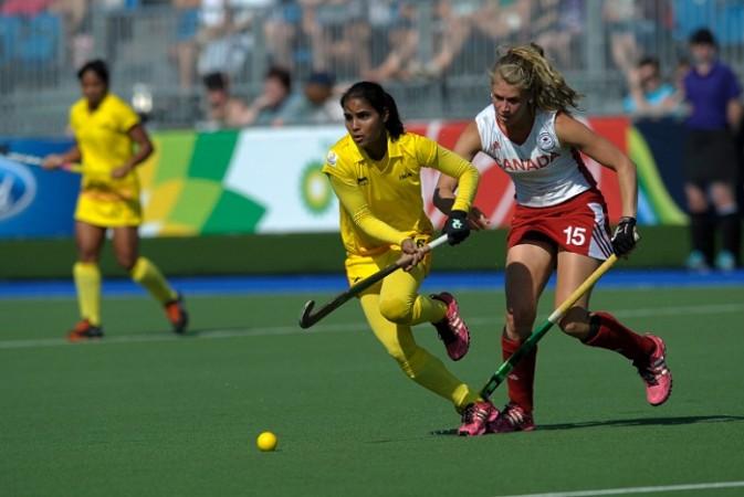 Vandana Katariya gets away from Canada's Abigail Raye in the Glasgow Commonwealth Games. Vandana Kataria