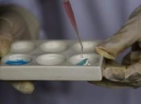A packet of cocaine exploded inside a man's stomach while flying to Britain from Antigua.