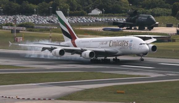 An Emirates Airbus A380 lands on the runway at Manchester Airport at Manchester Airport, northern England June 25, 2013