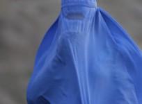 A woman wearing the traditional burqa.
