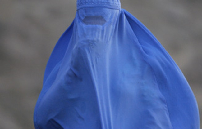A woman wearing the traditional burqa.