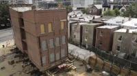 workers-put-final-touches-to-move-building-in-dc
