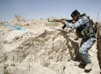 A member of the Iraqi security forces takes position during a patrol looking for militants of the ISIS at the border between Iraq and Saudi Arabia in June.