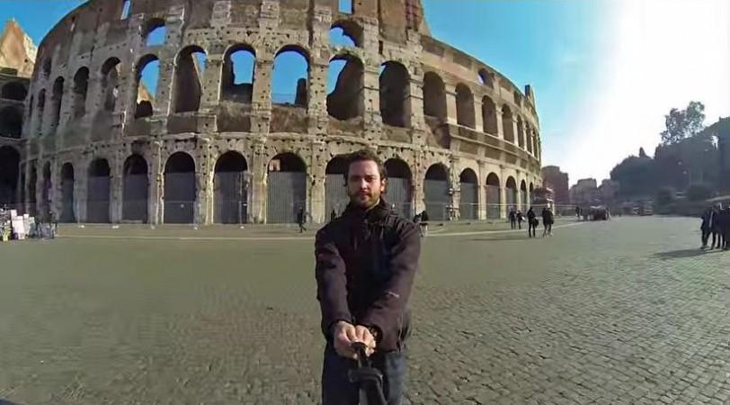Alex Chacon in front of the Colosseum. Alex Chacon
