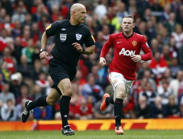 Manchester United's Wayne Rooney shouts at referee Howard Webb during a Premier League match. Howard Webb with Wayne Rooney