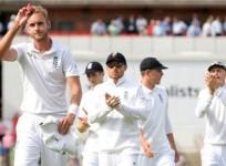 England's Stuart Broad holds the ball as he leaves the field after taking six wickets during the fourth cricket test match against India at the Old Trafford cricket ground in Manchester, England