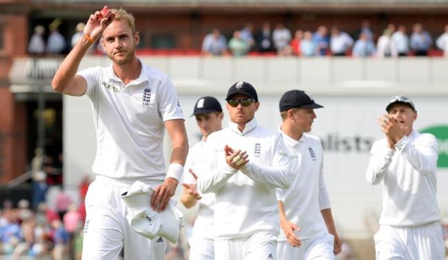 England's Stuart Broad holds the ball as he leaves the field after taking six wickets during the fourth cricket test match against India at the Old Trafford cricket ground in Manchester, England