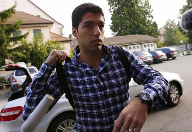 Uruguayan striker Luis Suarez arrives for a hearing at the Court of Arbitration for Sport (CAS) in Lausanne August 8, 2014. Suarez is appealing against a four-month ban from all football-related activities for biting Italy defender Giorgio Chiellini during the 2014 World Cup in Brazil. Luis Suarez