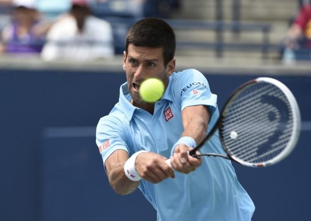 Novak Djokovic lines up a forehand against Jo-Willfried Tsonga. Novak Djokovic