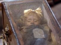 Fully clothed human remains of Rosalia Lombardo, two-years old, representing some of the world's best-preserved bodies, are displayed at the Capuchin Catacombs in Palermo, southern Italy, January 31, 2011.