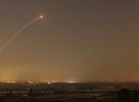 An interception by the Iron Dome anti-missile system is seen as rockets are launched from Gaza towards Israel before a 72-hour ceasefire was due to expire August 13, 2014.