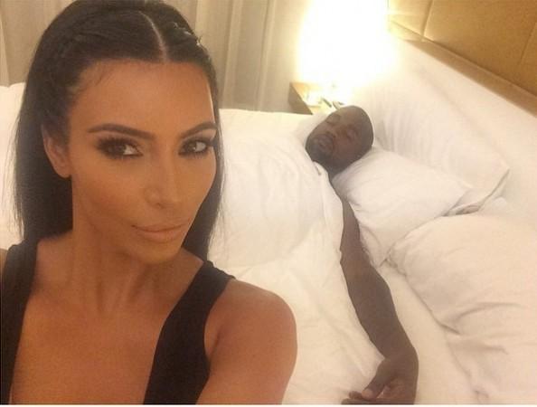 Kim takes a selfie as Kanye sleeps Kim Kardashian selfie
