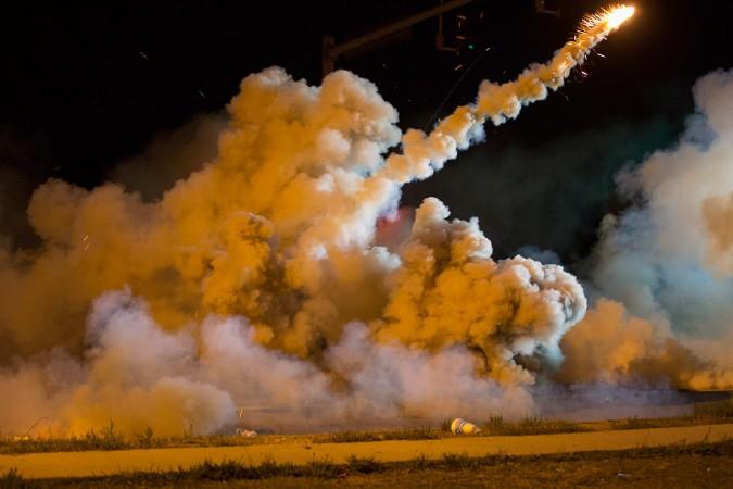 Ferguson Police fire tear gases on protesters Ferguson Police fire tear gases on protesters