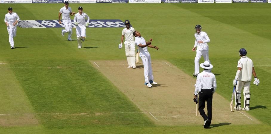 England's Chris Jordan (5th L) throws the ball up after catching India's Ajinkya Rahane (4th L) during the fifth cricket test match at the Oval cricket ground, London