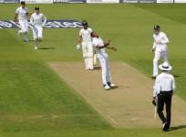 England's Chris Jordan (5th L) throws the ball up after catching India's Ajinkya Rahane (4th L) during the fifth cricket test match at the Oval cricket ground, London