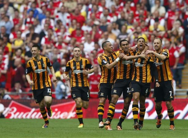Hull City players celebrate with their team mate Curtis Davies (2R) after he scored his team's second goal against Arsenal during their FA Cup final. Hull City
