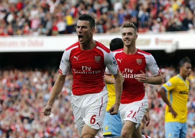 Arsenal defender Laurent Koscielny celebrates after scoring the equaliser against Crystal Palace in the English Premier League Laurent Koscielny Calum Chambers Arsenal