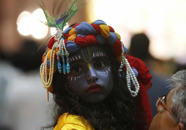 A child dressed as Hindu Lord Krishna attends a fancy dress competition at a temple during celebrations before the Janmashtami festival in the northern Indian city of Chandigarh Janmashtami