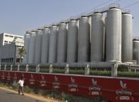 A man walks outside the factory of United Breweries Ltd (UB) that manufactures Kingfisher beer in Thiruvalluar district of the southern Indian state of Tamil Nadu