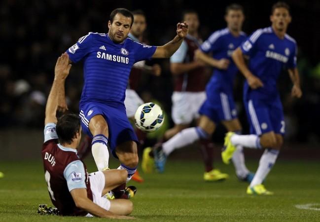 Burnley defender Michael Duff goes in for a tackle on Chelsea midfielder Cesc Fabregas during their English Premier League game Chelsea Cesc Fabregas Burnley Michael Duff