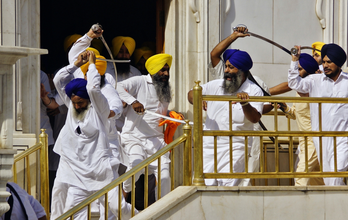 Amritsar, India
Sikhs wield swords during their clash inside the complex of the holy Sikh shrine, the Golden Temple, in the northern Indian city of Amritsar June 6, 2014. Sikhs wielding swords clashed inside the compound of their religion's holiest shrine on Friday, the 30th anniversary of a controversial raid by Indian security forces that flushed out separatist militants holed up in the temple. World Photography day