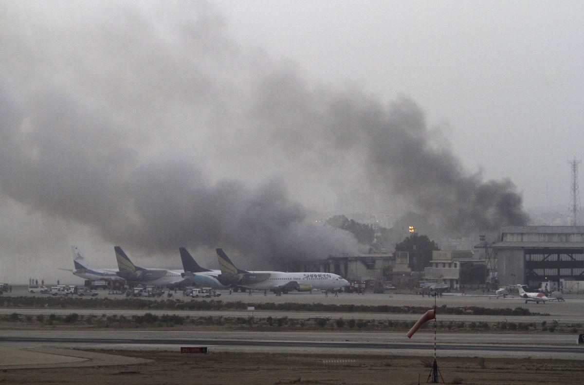 Karachi, Pakistan
Smoke billows from Jinnah International Airport in Karachi June 9, 2014. Gunmen attacked one of Pakistan's biggest airports on Sunday and at least 23 people were killed, including all 10 of the attackers, media reported. World Photography day