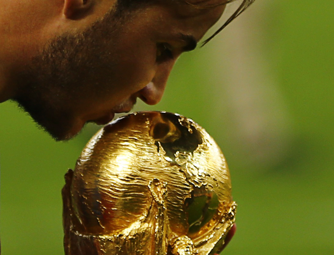 Rio De Jeneiro, Brazil
Germany's Mario Goetze kisses the World Cup trophy as he celebrates their 2014 World Cup final win against Argentina at the Maracana stadium in Rio de Janeiro July 13, 2014. World Photography day