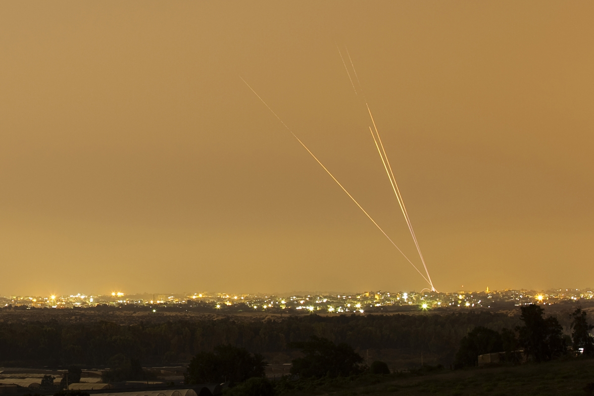 Smoke trails are seen as rockets are launched towards Israel from the northern Gaza Strip, 12 July 2014. World Photography Day