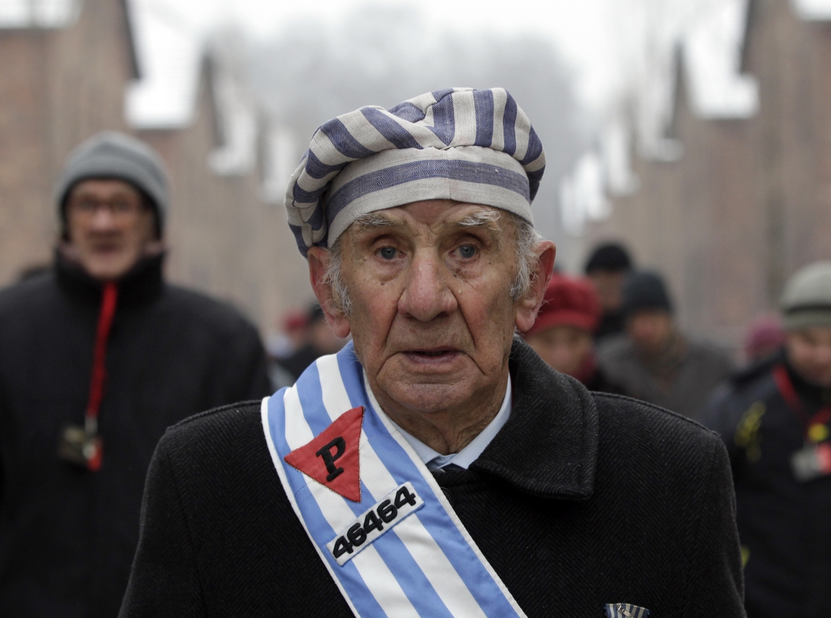 Auschwitz, Poland
A Holocaust survivor walks inside the former concentration camp before a ceremony to mark the 69th anniversary of the liberation of Auschwitz concentration camp and to remember the victims of the Holocaust in Auschwitz January 27, 2014. The world marks International Holocaust Remembrance Day on January 27 to remember those who died during the Nazi organised genocide during World War Two that cost the lives of millions of Jews, Roma and Sinti, homosexuals and opponents to Germany's fascist regime and its collaborators. World Photography day