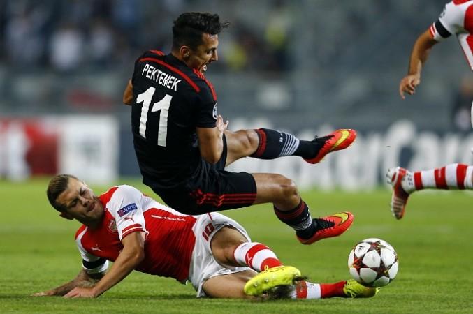 Arsenal midfielder goes in for a tackle on Besiktas forward Mustafa Pektemek in their Champions League qualifier first leg Arsenal Jack Wilshere Besiktas Mustafa Pektemek