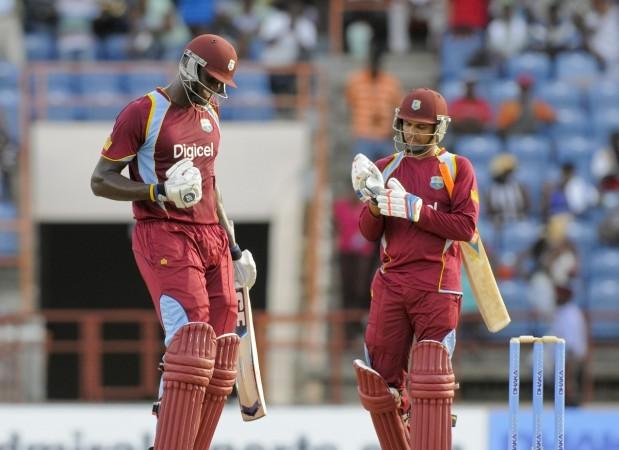 West Indies' Jason Holder and Sunil Narine celebrate three-wicket win over Bangladesh. Jason Holder and Sunil Narine