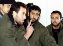 (L-R) Raed al-Attar, Mohammed Abu Shammala and Osama Abu Atah from Hamas, stand before a Palestinian Authority court in Gaza in this February 27, 1999 file photo.