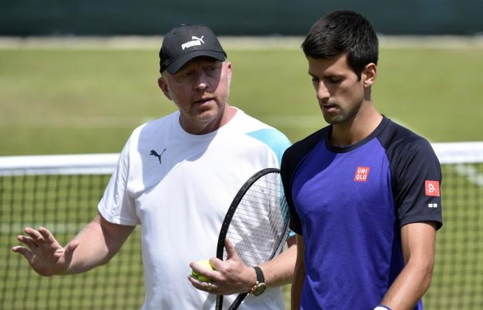 Novak Djokovic of Serbia (R) speaks with coach Boris Becker during a training session Boris Becker and Novak Djokovic