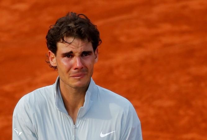 Rafael Nadal of Spain is overcome with emotion as he attends the trophy ceremony after defeating Novak Djokovic of Serbia during their men's singles final match to win the French Open 2014. Rafael Nadal