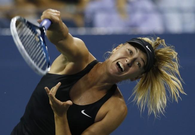 Maria Sharapova serves to compatriot Maria Kirilenko during their match at the 2014 US Open. Maria Sharapova