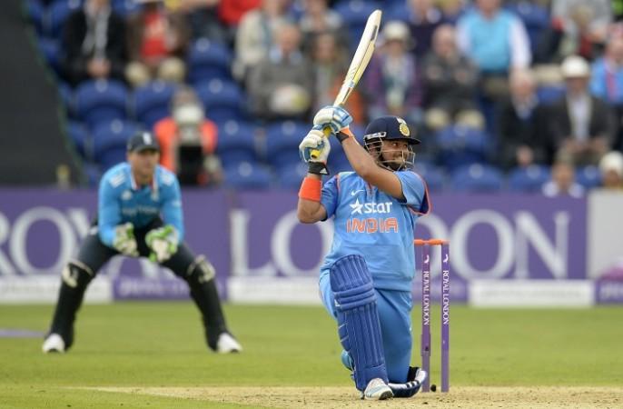 India batsman Suresh Raina admires his own shot during his magnificent century against England in the second one-day international Suresh Raina India Jos Buttler England