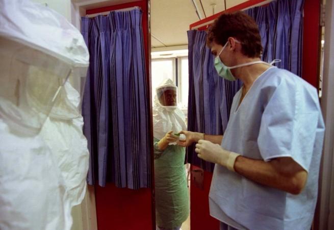 The only confirmed case of the Ebola Virus Disease in South Africa was in 1996. A nurse (L) is treating South Africa's first known Ebola virus victim hands a sample to Dr David Voss from the isolation ward at Johannesburg Hospital, November 18, 1996. The victim, nursing sister Marilyn Lahana, is believed to have contracted the virus from a Gabonese doctor she was treating. Ebola 1996