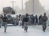 Afghan security forces arrive at the site of an attack in the city of Jalalabad August 30, 2014. At least six people were killed and dozens wounded when a suicide car bomber and Taliban gunmen attacked an office of the Afghan intelligence agency in the ea