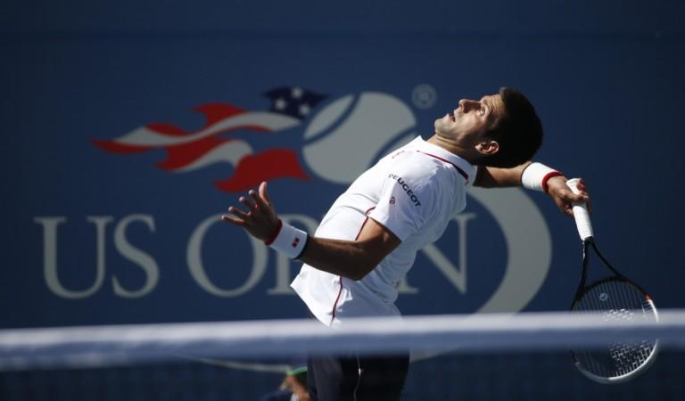 Novak Djokovic of Serbia serves to Paul-Henri Mathieu of France during their match at the 2014 U.S. Open tennis tournament. Novak Djokovic