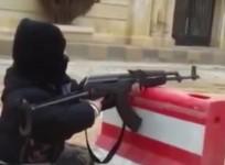 A 10 year old boy fires an AK 47 in an ISIS training camp.