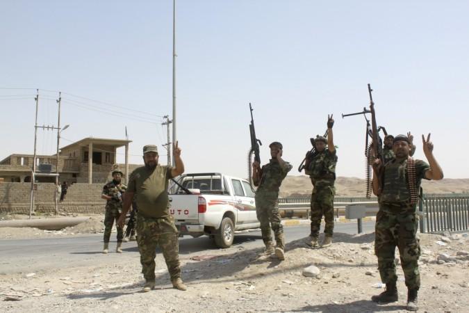 Iraqi security forces and Iraqi Shi'ite volunteers react after breaking a siege by the Islamic State extremist group on Amerli August 31, 2014. Iraqi security forces and Iraqi Shi'ite volunteers react after breaking a siege by the Islamic State extremist group on Amerli August 31, 2014.