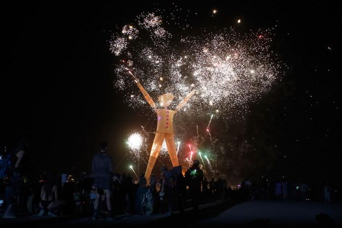 Thousands enjoyed the fireworks before the Burning Man was set on fire. Thousands enjoyed the fireworks before the Burning Man was set afire.