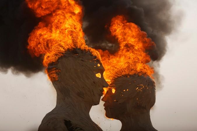 The burning of an art installation titled Embrace prior to the The Burning Man fireworks The burning of an art installation titled Embrace