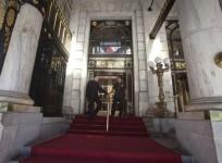 Employees stand at the main entrance to the Plaza Hotel in the Manhattan borough of New York August 18, 2014