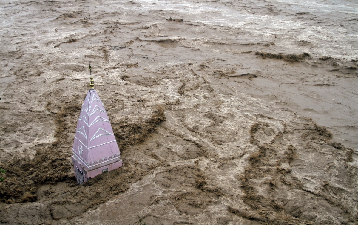 Flood waters rage across a temple in Kashmir Kashmir Floods