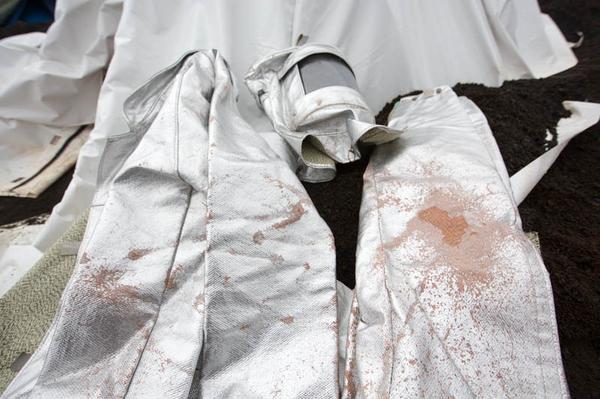 The heat suit destroyed due to the potent acid rain on the volcano Man takes an Incredible Selfie inside an Active Volcano