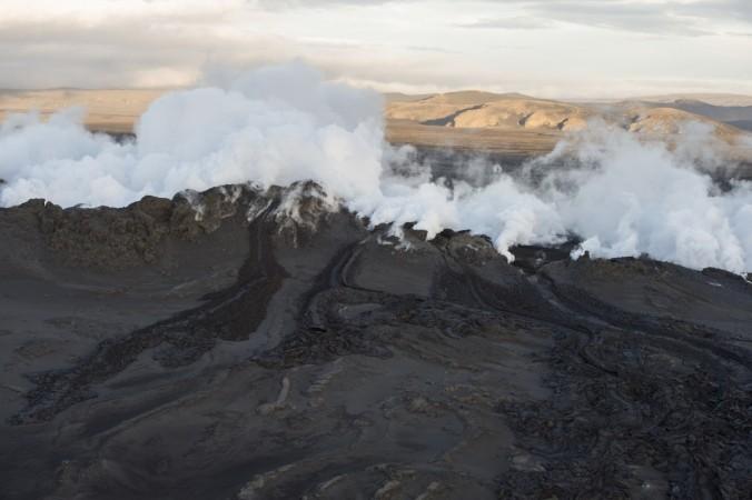 Steam and smoke rise over a 1-km-long fissure in a lava field north of the Vatnajokull glacier, which covers part of Bardarbunga volcano system, August 29, 2014. Iceland's Bardarbunga volcano