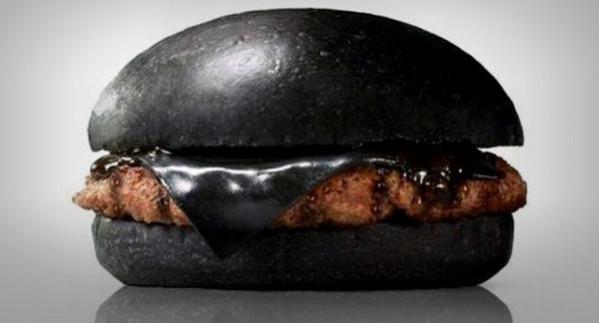 Black Cheese Burger with black cheese and black coloured sauce. Black Cheese Burgers